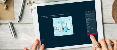 Draufsicht auf ein Tablet, das eine Webseite mit einer Produktübersicht der Malu Wilz Hydro-Linie anzeigt, während eine Hand die Download-Option für ein Bild auswählt.