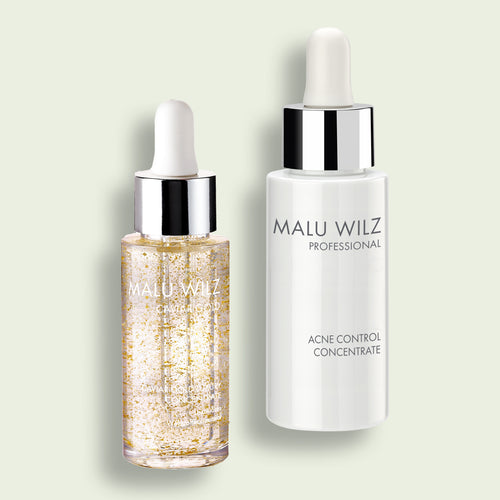 Zwei Malu Wilz Konzentrate: das goldene 'Caviar Gold Luxury Concentrate' und das weiße 'Acne Control Concentrate'.